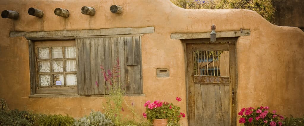 The exterior of a traditional adobe-style home in Santa Fe, New Mexico.