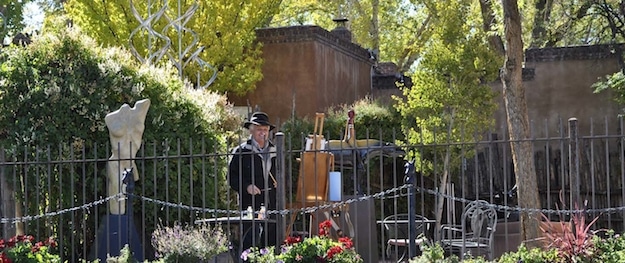 An artist working on an oil pianting on Canyon Road, Santa Fe