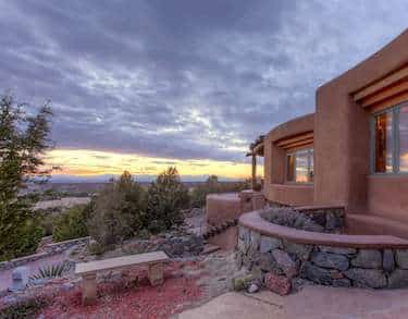 Santa Fe home with a view of the mountains during sunset