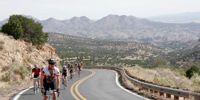Competitive cyclists racing along a Santa Fe highway