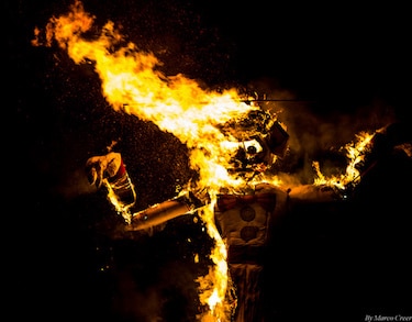 Dramatic image of Zozobra on fire