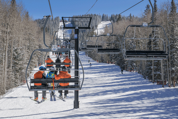 People riding the ski lift at Ski Santa Fe