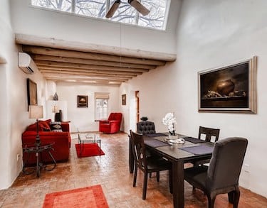 The dining room and living room of a home on Canyon Road, Santa Fe