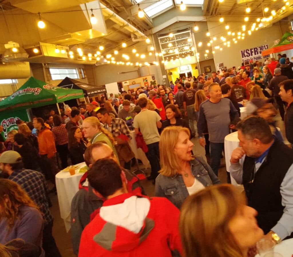 People attending a beer festival at the Santa Fe Railyard.