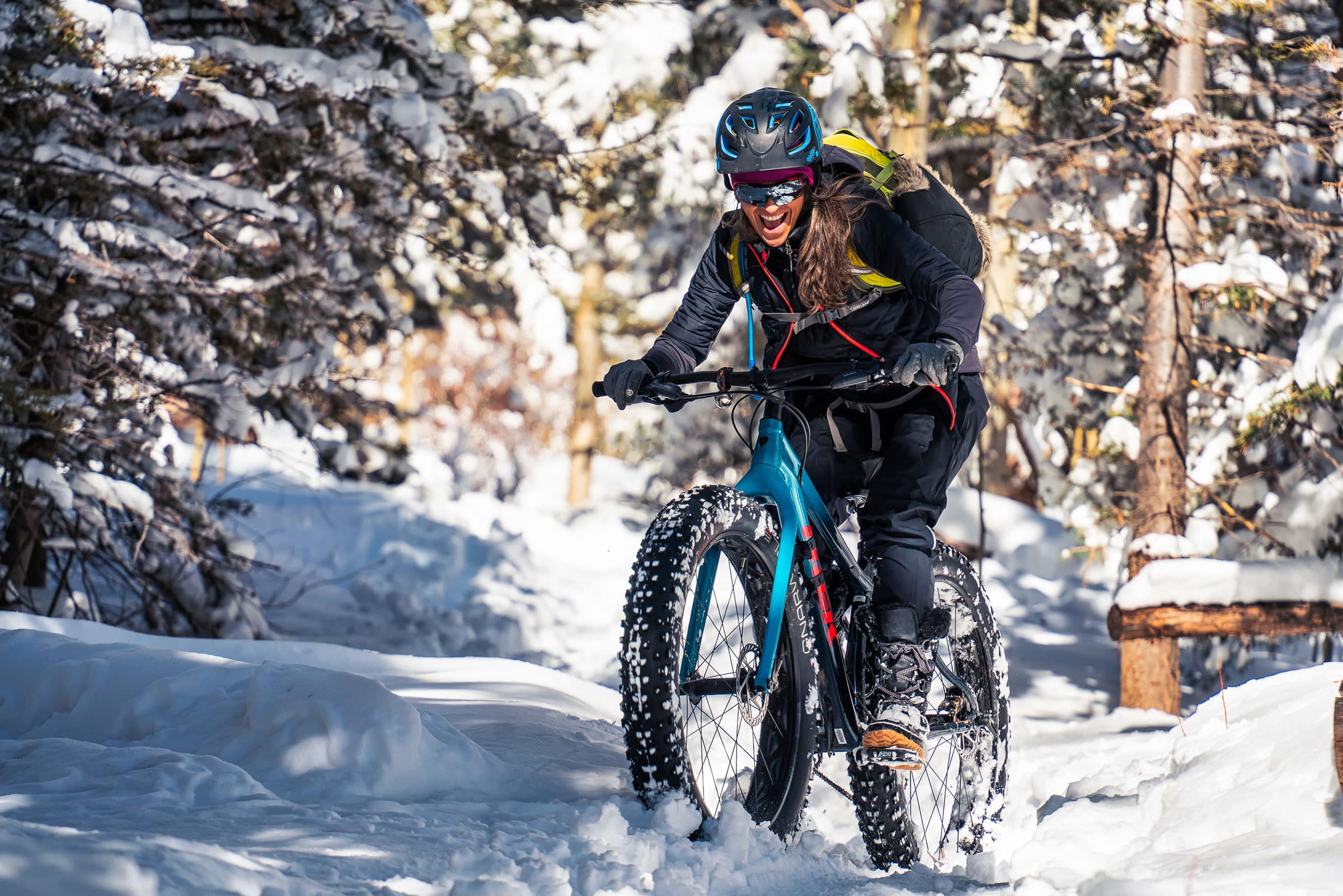 Woman riding a fat tire bicycle in the snow, Santa Fe